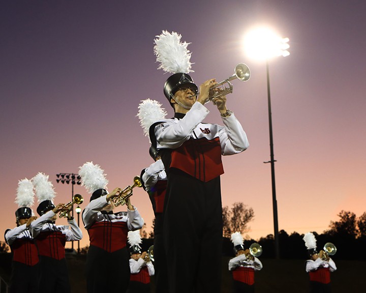 Band students performing during a football game