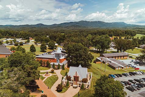 Drone shot of NGU's Prayer Chapel with the Blue Ridge mountains in the background