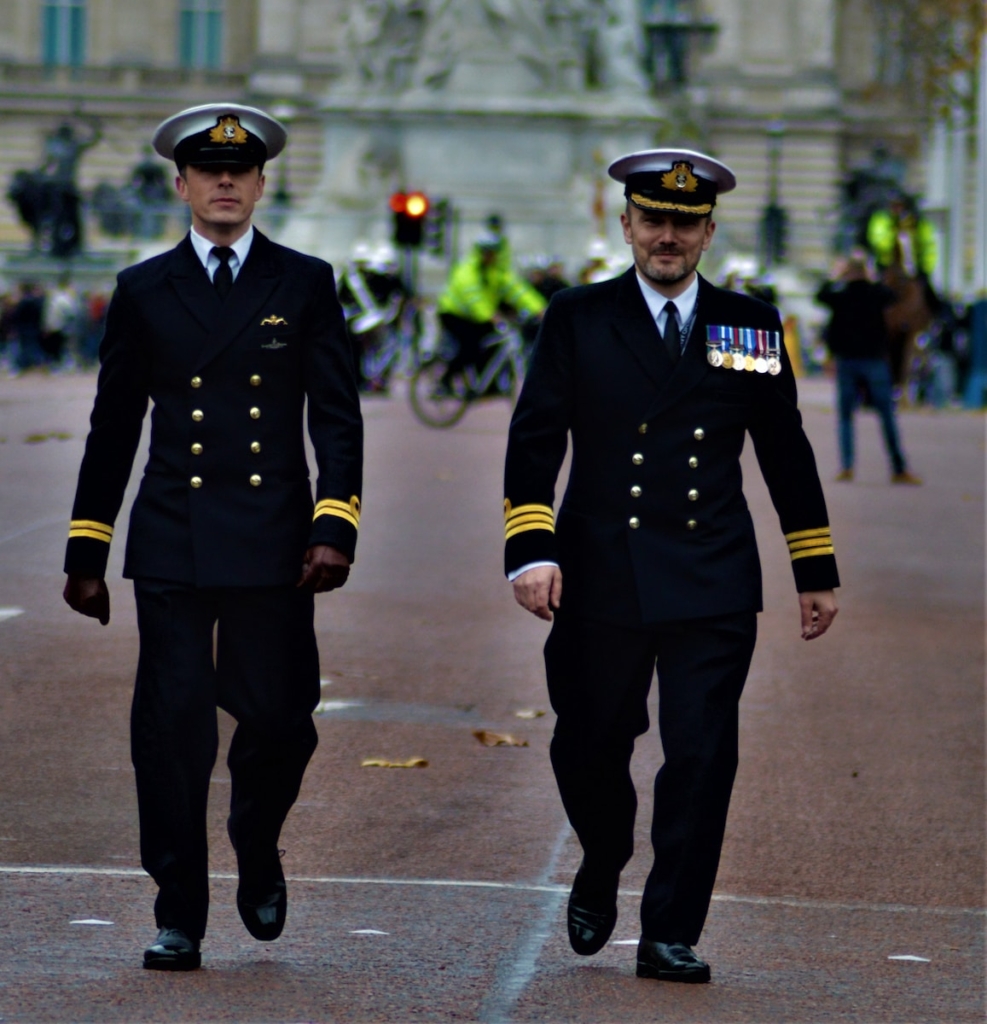 two men in uniform walking side by side